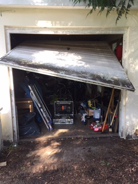Garage door broken up and over garage door
