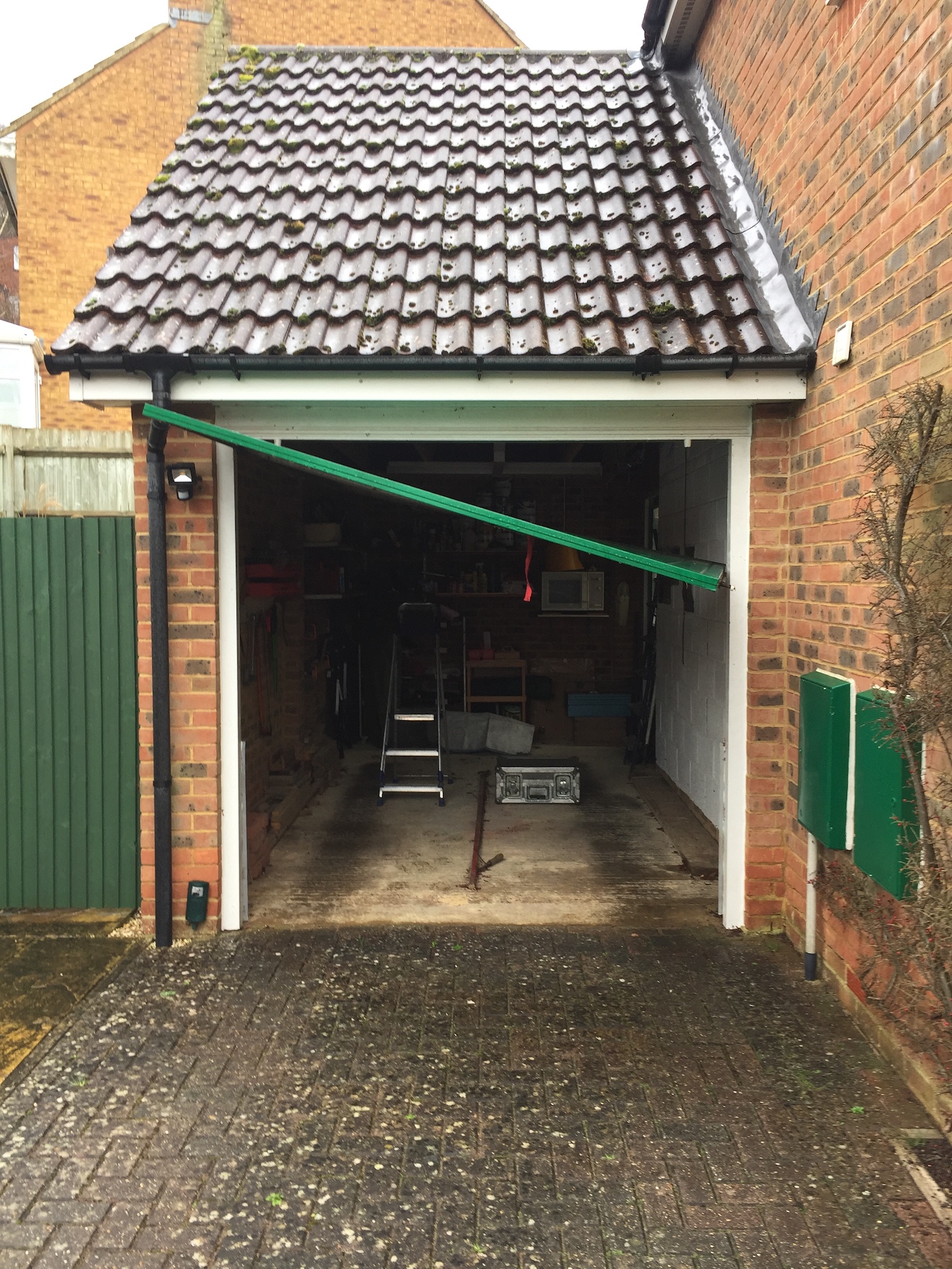 Garage door broken up and over garage door