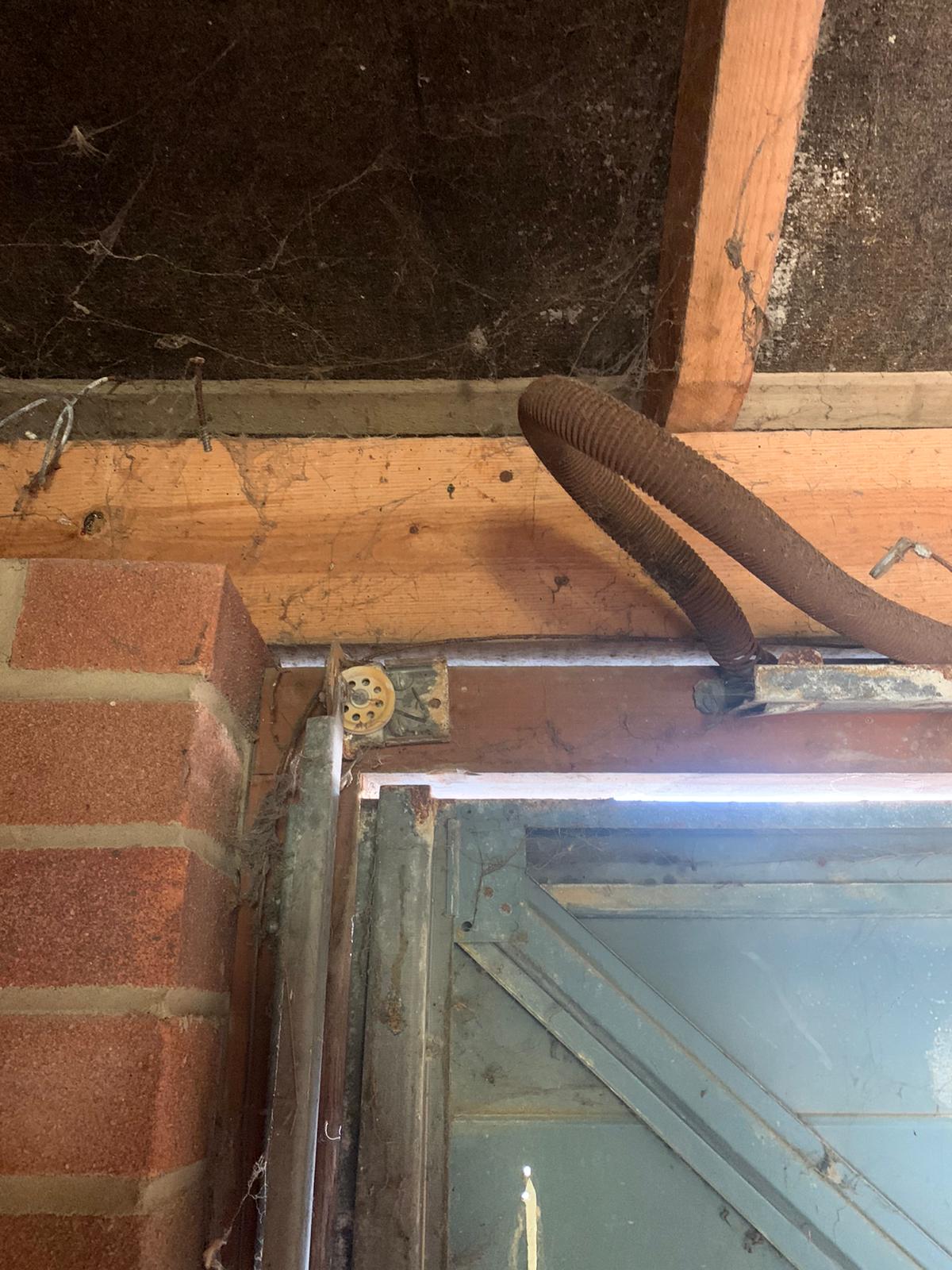 Garage door broken up and over garage door