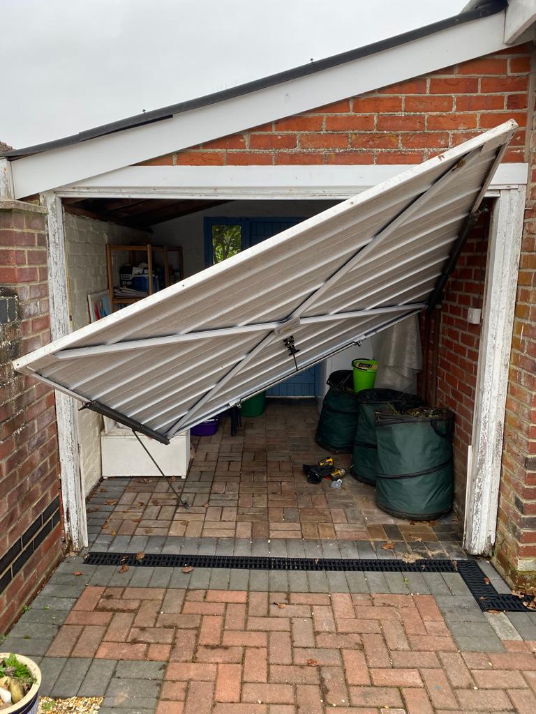Garage door broken up and over garage door