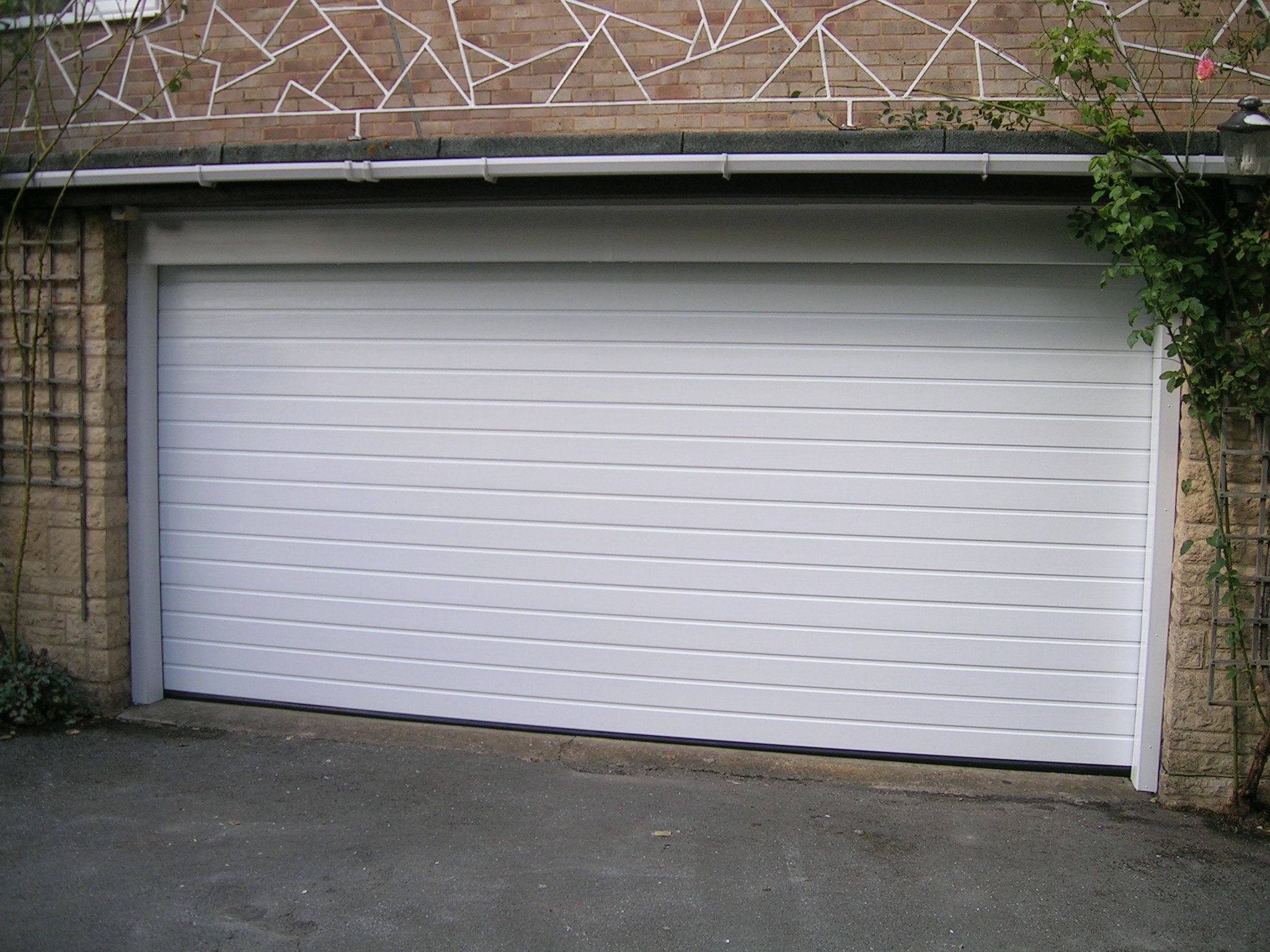 Garage door broken up and over garage door Garage door broken up and over garage door