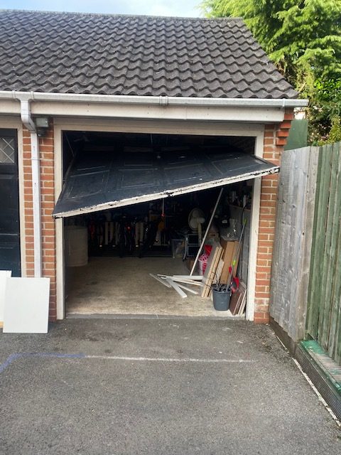 Garage door broken up and over garage door