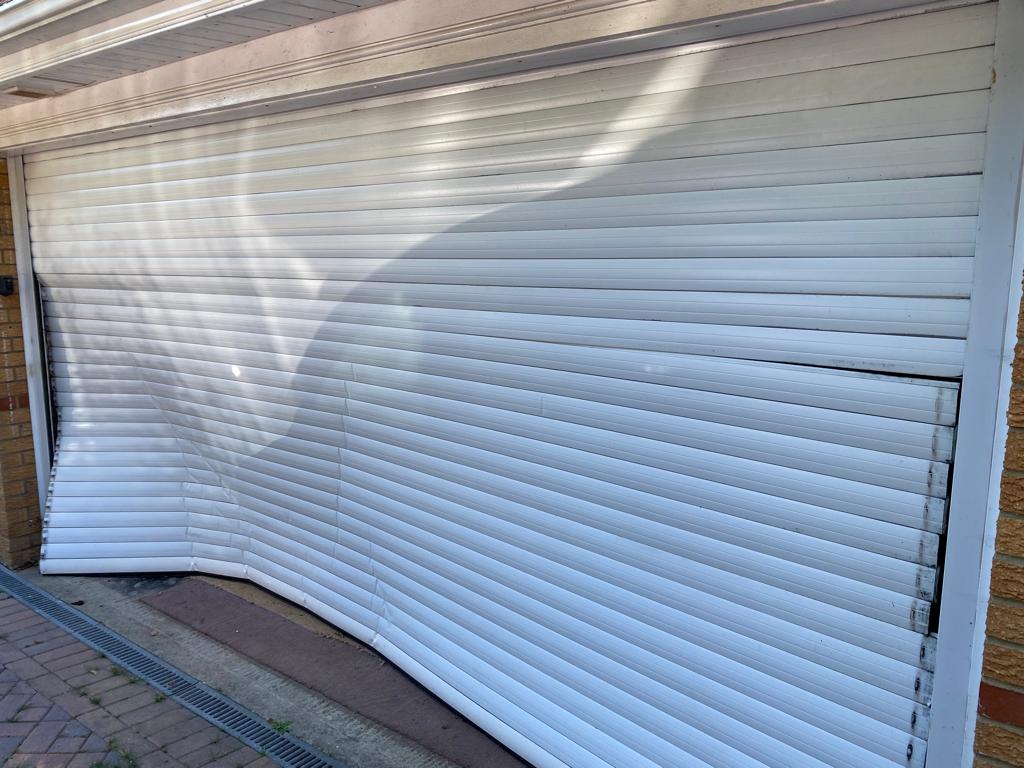 Garage door broken up and over garage door Garage door broken up and over garage door