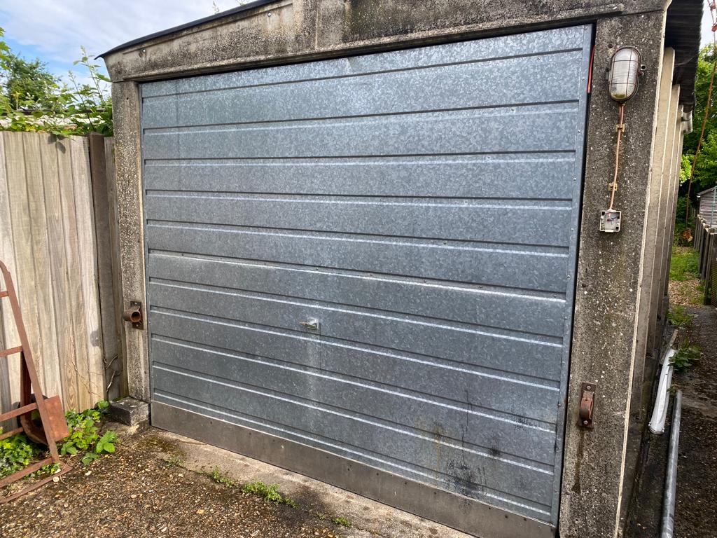 Garage door broken up and over garage door
