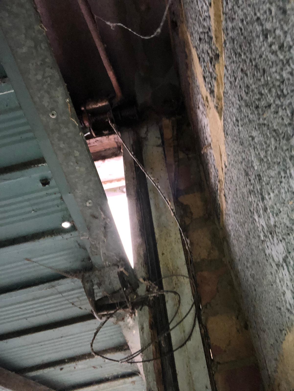 Garage door broken up and over garage door