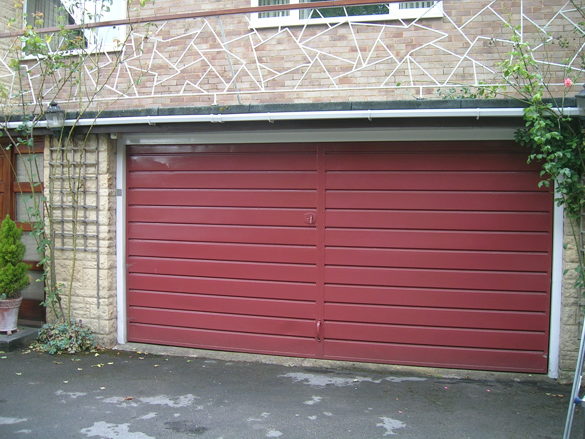Garage door broken up and over garage door Garage door broken up and over garage door